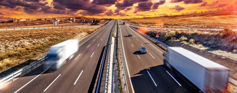 Trucks speeding along the highway