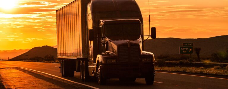 Truck driving at sunrise